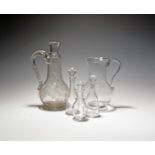 Two large glass jugs, c.1770 and 19th century, one raised on a low circular foot, the other