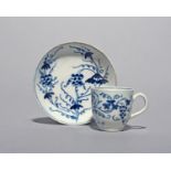 A Bow miniature blue and white coffee cup and saucer, c.1760, the small forms naively painted with