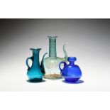Three Continental glass ewers or jugs, 18th/early 19th century, the ewers of Persian form with