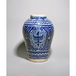 A large Talavera de Puebla (Mexico) vase, c.1720, painted in blue with stylized eagle motifs on a