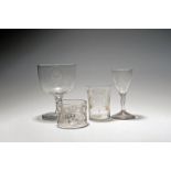 Four armorial glasses, c.1770 and later, one engraved with the initials 'RDV' beneath a crown, the