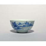 A Vauxhall blue and white bowl, c.1755-60, painted with a Chinese figure fishing from a sampan in