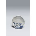 A RARE JAPANESE BLUE AND WHITE MOULDED DISH (MUKOZUKE) EDO PERIOD, C.1655-80 With a foliate rim, the