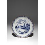 A JAPANESE ARITA BLUE AND WHITE DISH EDO PERIOD, C.1700 With a scalloped rim, the well decorated