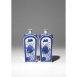 A PAIR OF JAPANESE BLUE AND WHITE SAKE BOTTLES (TOKKURI) EDO PERIOD, 18TH CENTURY The square-section