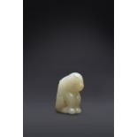 A RARE CHINESE PALE CELADON JADE FELINE PROBABLY SONG DYNASTY The feline seated on its haunches,