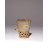 A RARE CHINESE RETICULATED POTTERY CUP NEOLITHIC, DAWENKOU CULTURE The gently flaring body with a