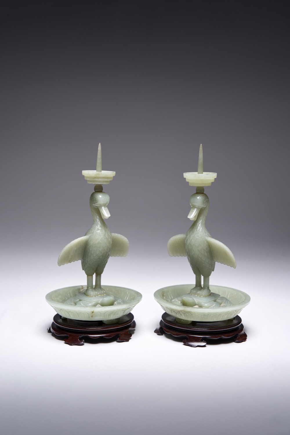 A PAIR OF CHINESE CELADON JADE GOOSE AND TORTOISE PRICKET CANDLESTICKS QIANLONG 1736-95 Each