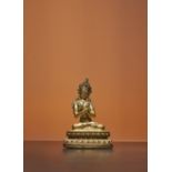 A TIBETAN GILT-BRONZE FIGURE OF VAJRADHARA 16/17TH CENTURY Depicted seated in dhyanasana on a double