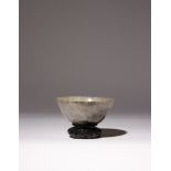 A CHINESE MOTTLED GREY AND BLACK JADE BOWL QING DYNASTY With curved sides gently thinning towards