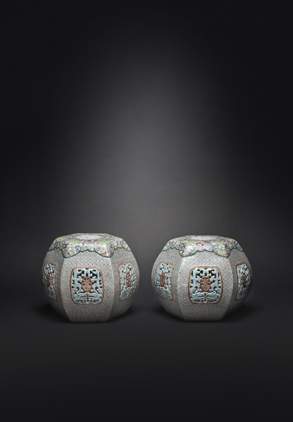 A RARE PAIR OF CHINESE HEXAGONAL ARM RESTS YONGZHENG 1723-35 The sides decorated with reticulated
