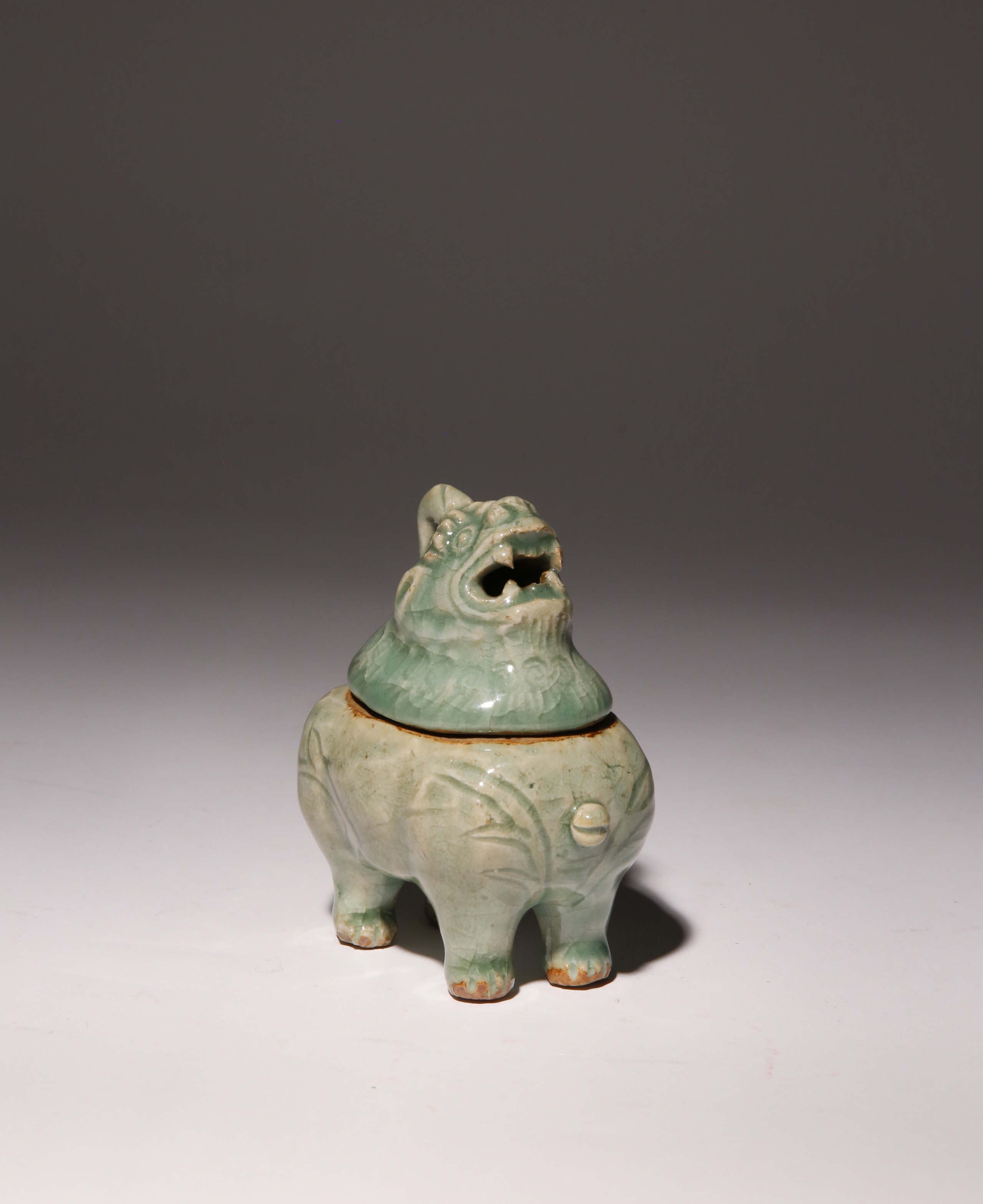 A SMALL CHINESE LONGQUAN CELADON LUDUAN INCENSE BURNER AND COVER MING DYNASTY The mythical beast