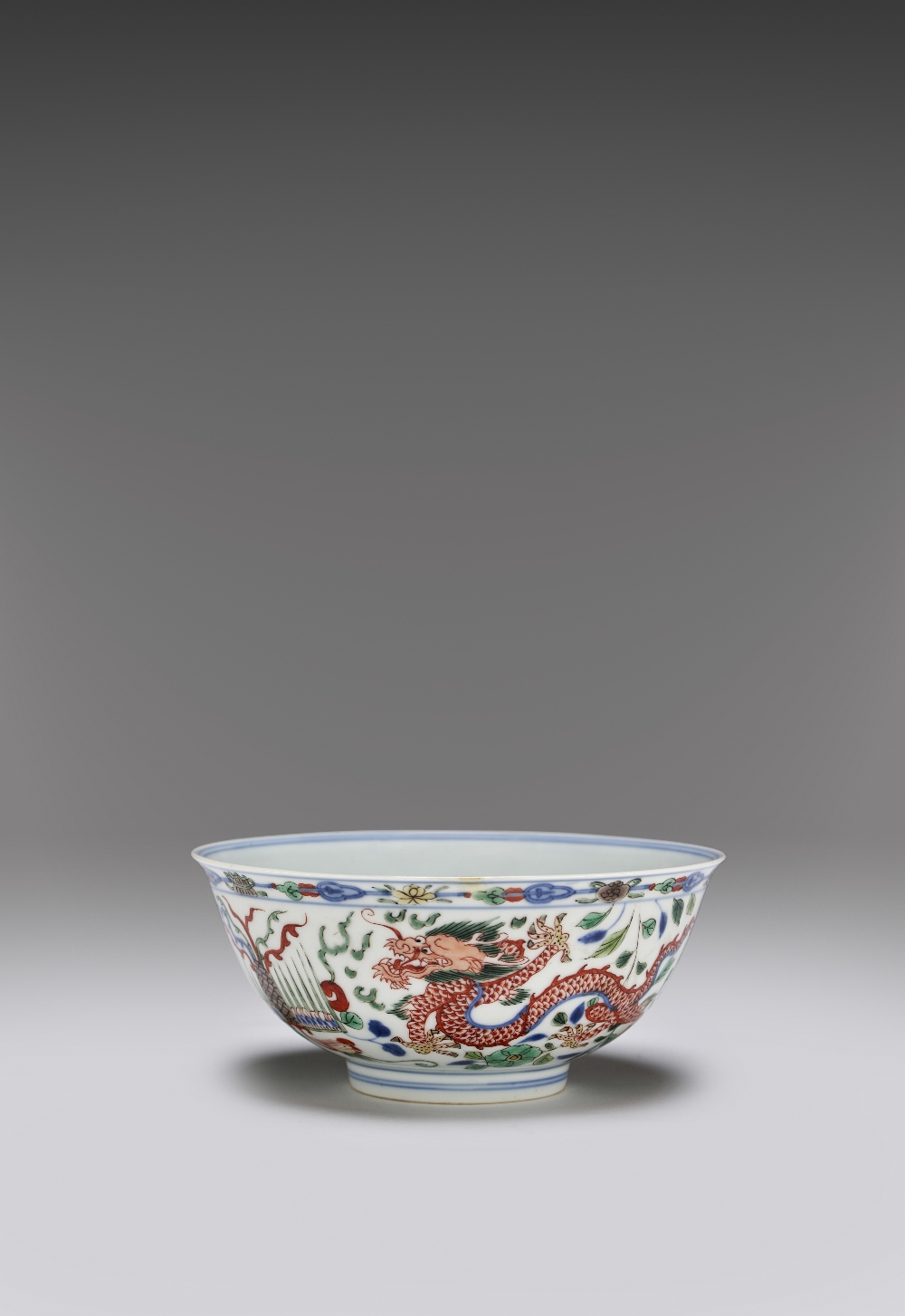 A RARE CHINESE IMPERIAL WUCAI 'DRAGON AND PHOENIX' BOWL SIX CHARACTER YONGZHENG MARK AND OF THE