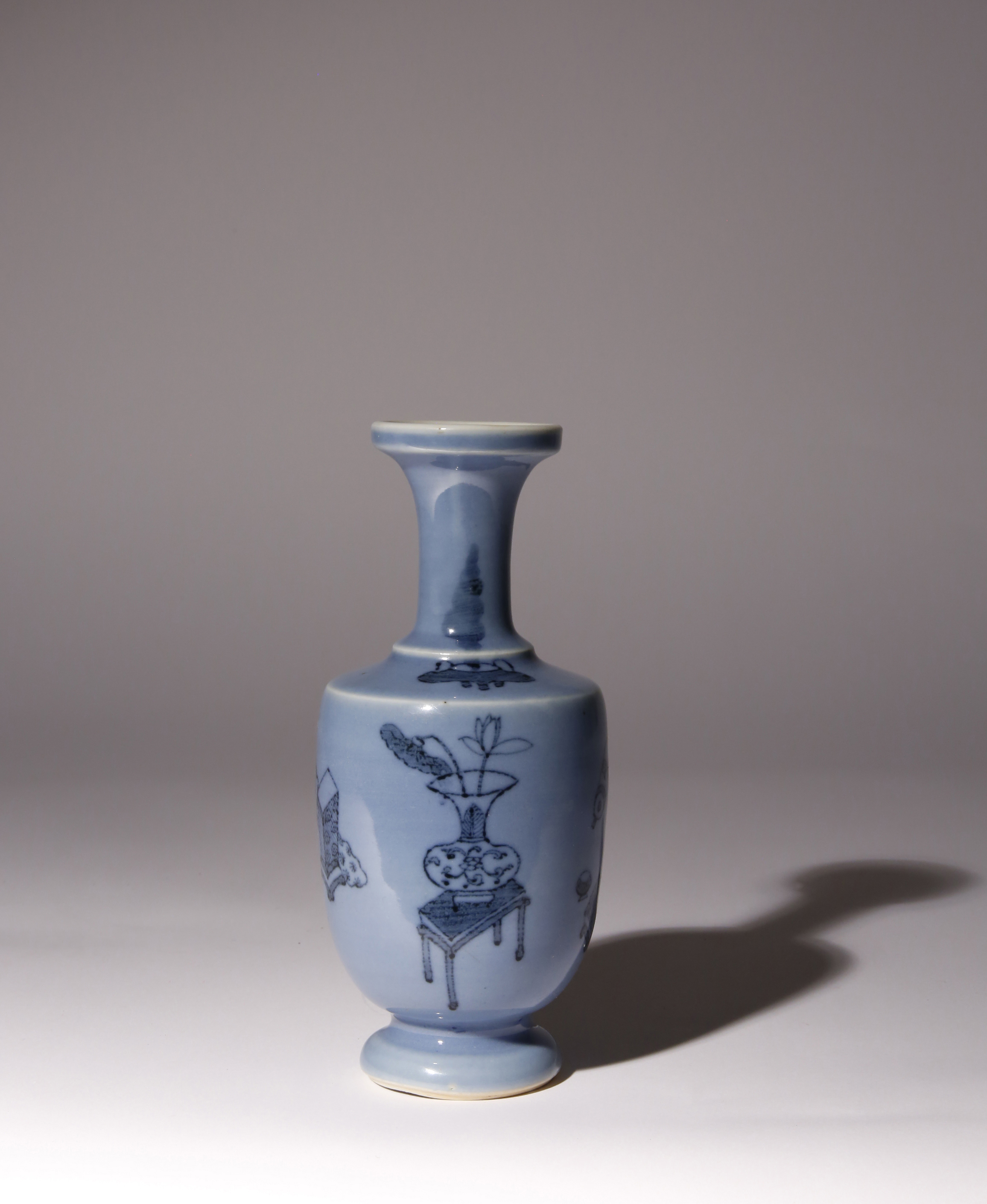 A SMALL CHINESE LAVENDER-GROUND AND UNDERGLAZE BLUE BALUSTER VASE 18TH CENTURY The cylindrical
