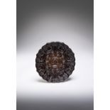 A CHINESE CARVED BLACK TIXI LACQUER BRACKET-LOBED DISH 15TH CENTURY The lobed sides rising to a