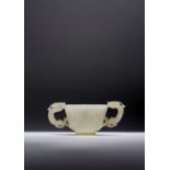 A CHINESE PALE CELADON JADE 'CHILONG' CUP 17TH CENTURY Carved with two shou characters amidst