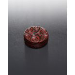 A SMALL CHINESE CARVED RED TIXI LACQUER CIRCULAR BOX AND COVER 17TH/18TH CENTURY The cover and sides