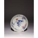 A CHINESE UNDERGLAZED BLUE AND COPPER-RED BOWL KANGXI 1662-1722 The interior decorated with lotus