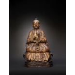 A LARGE CHINESE GILT AND LACQUERED BRONZE FIGURE OF SHANGQING LATE MING DYNASTY The seated deity