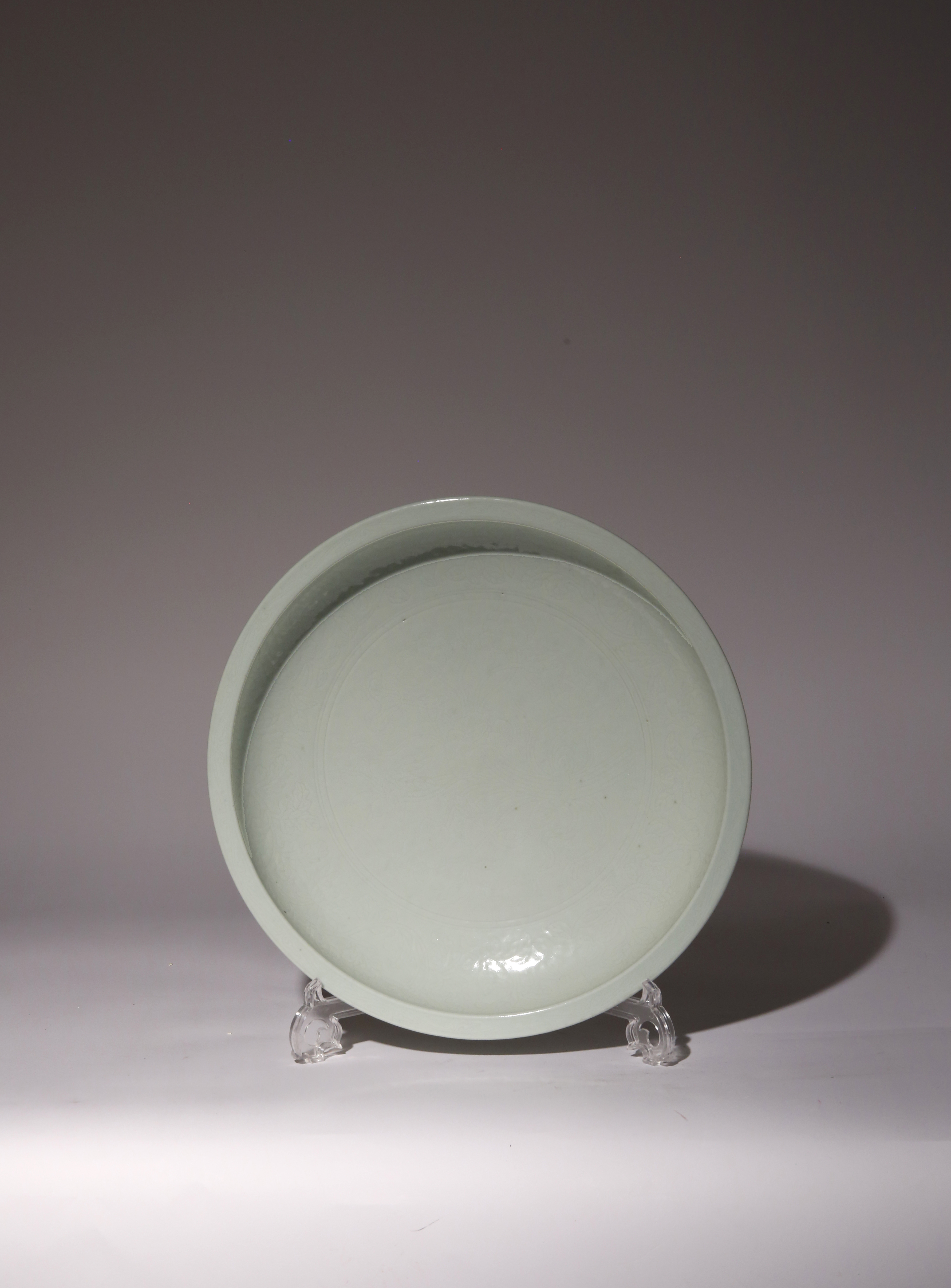 A CHINESE MING STYLE PALE CELADON GLAZED LARGE SHALLOW BOWL 18TH CENTURY Incised with a large