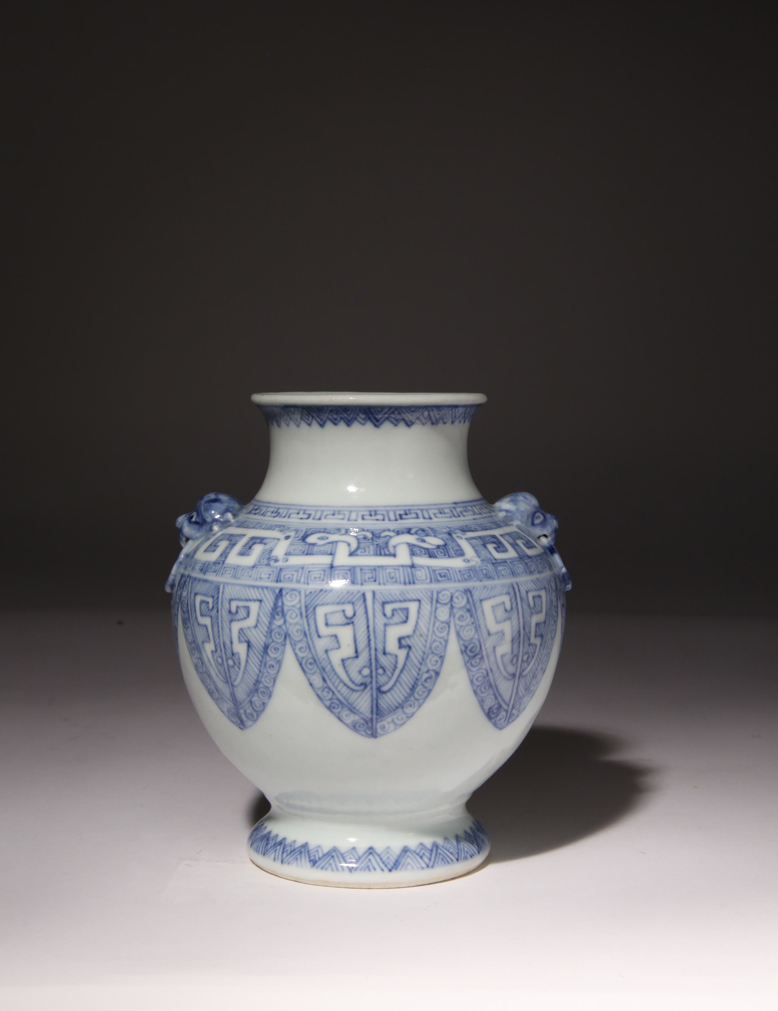 A CHINESE BLUE AND WHITE ARCHAISTIC VASE 18TH CENTURY Decorated with bands of overlapping stylised