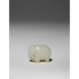 A SMALL CHINESE WHITE JADE CARVING OF AN ELEPHANT QING DYNASTY The pachyderm stands four-square with