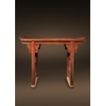 A CHINESE HONGMU ALTAR TABLE KANGXI 1662-1722 The rectangular top with raised scroll ends, the