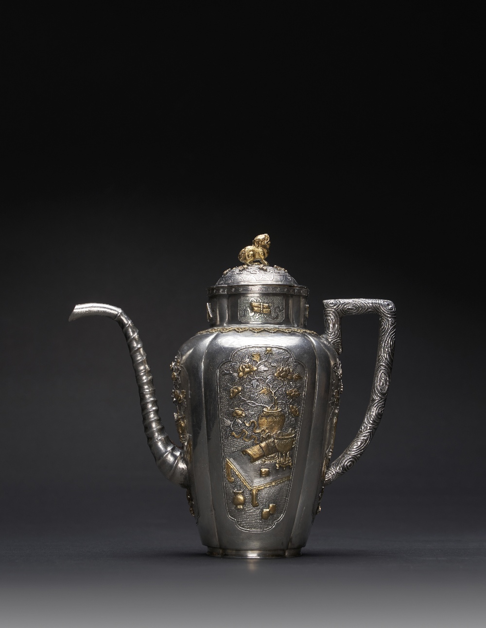 A RARE CHINESE PARCEL-GILT QUATREFOIL-SECTION EWER AND COVER KANGXI 1662-1722 The lobed body with