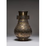 A LARGE CHINESE SILVER AND PARCEL-GILT VASE, HU PROBABLY QING DYNASTY The body decorated in relief