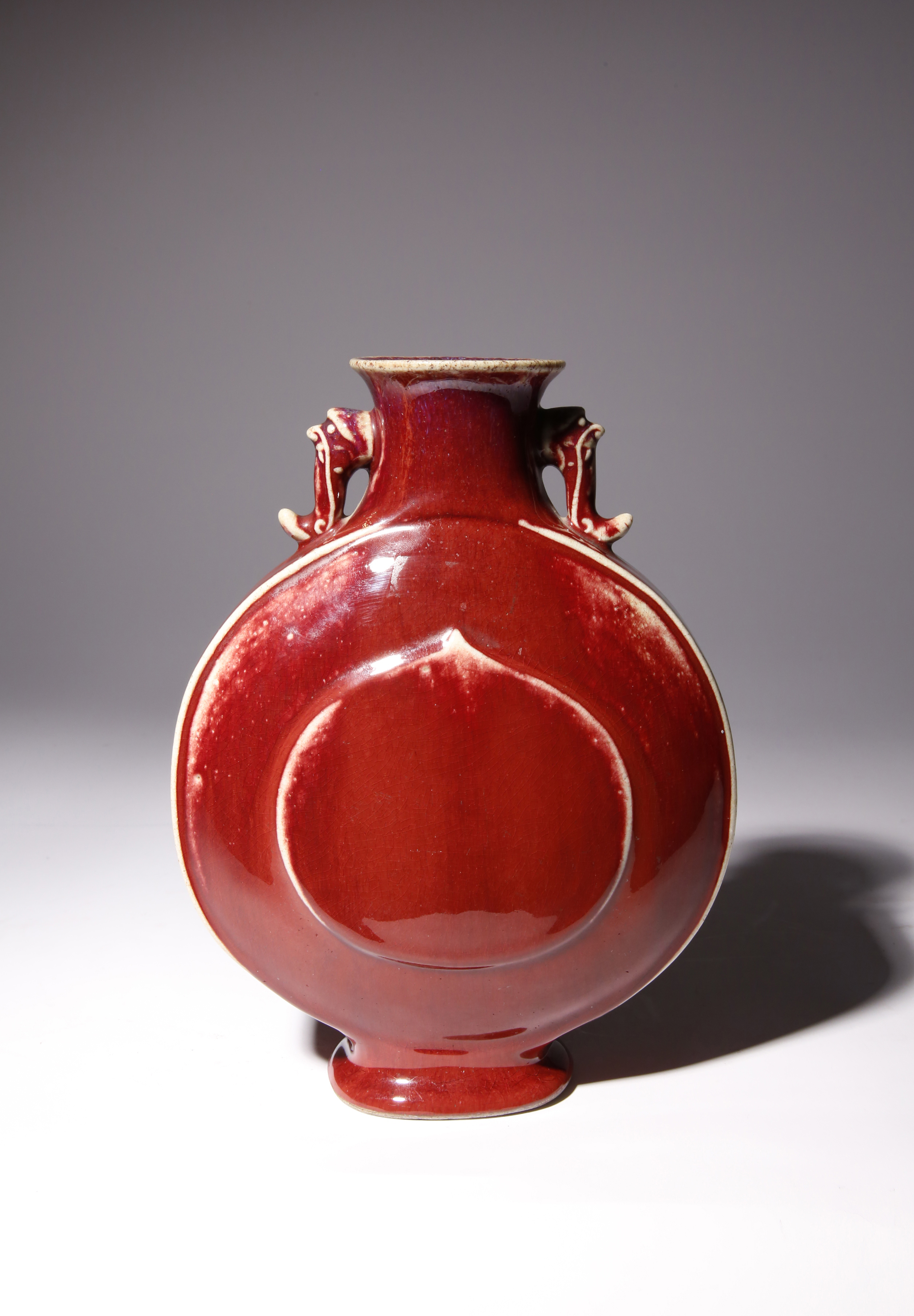 A CHINESE FLAMBE GLAZED MOONFLASK, BAOYUEPING QIANLONG 1736-95 The flattened circular body moulded