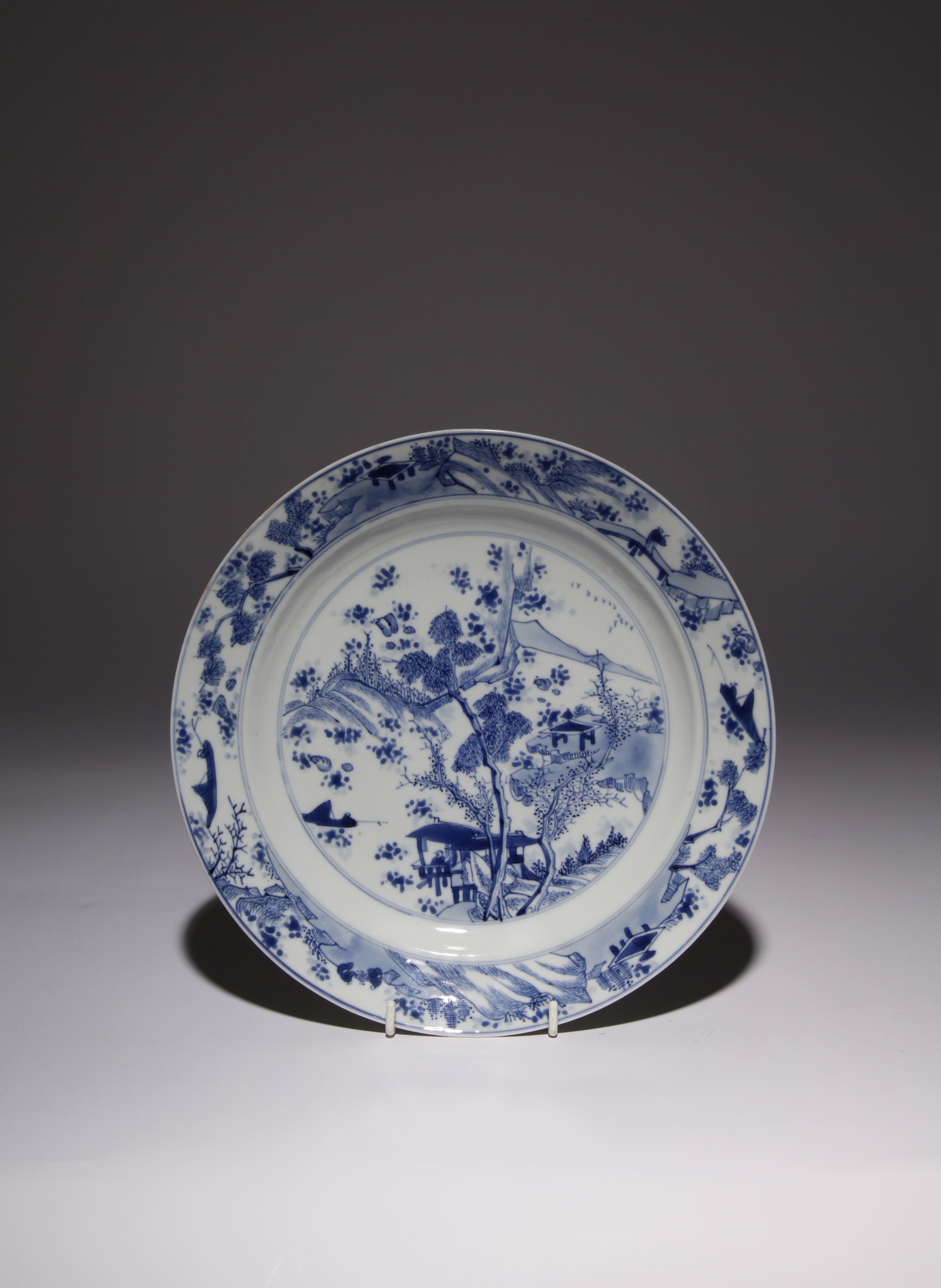 A CHINESE BLUE AND WHITE 'MASTER OF THE ROCKS' DISH KANGXI 1662-1722 The shallow rounded sides