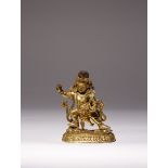 A RARE TIBETAN GILT-BRONZE FIGURE OF VAJRADHARA 15TH/16TH CENTURY Standing in a dynamic pose on a