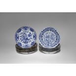 THIRTEEN CHINESE BLUE AND WHITE PLATES AND BOWLS 18TH CENTURY The plates painted with peony and