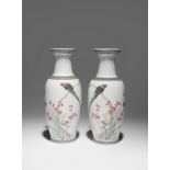 A PAIR OF CHINESE FAMILLE ROSE OVOID VASES 20TH CENTURY Each painted with birds perching on cherry