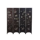 A CHINESE BLACK LACQUER EIGHTEEN LUOHAN FOUR-FOLD SCREEN LATE QING DYNASTY Inlaid with soapstone and