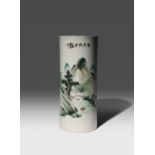A CHINESE CYLINDRICAL 'LANDSCAPE' VASE 20TH CENTURY The body painted with figures in a garden, and