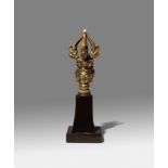 A TIBETO-CHINESE GILT-BRONZE GHANTA HANDLE 18TH CENTURY The Buddha's head wearing an eight-