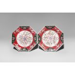 A PAIR OF CHINESE RUBY-GROUND FAMILLE ROSE OCTAGONAL DISHES 18TH CENTURY Painted with stylised