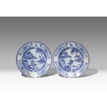 A PAIR OF CHINESE BLUE AND WHITE ARMORIAL PLATES 1ST HALF 18TH CENTURY The borders decorated with
