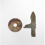 A CHINESE JADE BI DISC AND A JADE HALBERD BLADE, GE POSSIBLY WARRING STATES PERIOD The disc carved