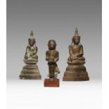 THREE SOUTHEAST ASIAN BRONZE FIGURES 18TH CENTURY AND LATER Two of Buddha, seated in dhyanasana on