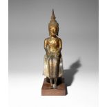 A THAI GILT-BRONZE SEATED FIGURE OF BUDDHA 16TH CENTURY OR LATER Wearing flowing robes, his hands
