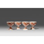 FOUR CHINESE IRON-RED 'DRAGON' STEM CUPS LATE QING DYNASTY Each with rounded sides painted in iron-