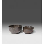 A CHINESE SILVER INGOT AND A SMALL OCTAGONAL SILVER BOWL QING DYNASTY The oval ingot with a three
