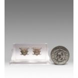 A PAIR OF SMALL CHINESE BRONZE MASK APPLIQUES AND A BRONZE MIRROR SPRING AND AUTUMN PERIOD AND