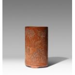 A CHINESE CARVED BAMBOO 'LANDSCAPE' BRUSHPOT, BITONG QING DYNASTY Of elliptical cross-section,