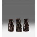 THREE CHINESE ZITAN INCENSE STICK HOLDERS 17TH/18TH CENTURY Carved as knotty tree stumps, one with a