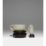 A CHINESE PALE CELADON JADE CUP AND A JADE FIGURE OF LIU HAI QING DYNASTY The cup with a single