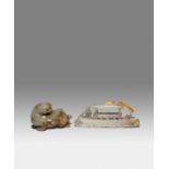 TWO CHINESE CELADON JADE CARVINGS OF A PIXIU AND A SAMPAN QING DYNASTY OR LATER One carved as a