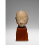 A BURMESE MARBLE HEAD OF BUDDHA 17TH/18TH CENTURY The face with a serene expression, subtly arched